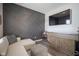 Stylish living room features a decorative wall, wet bar, and contemporary sectional sofa at 15557 Starflower Dr, Westfield, IN 46074