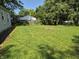 Grassy backyard with a firepit at 1584 Shady Ln, Columbus, IN 47201