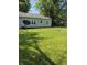 Large, grassy backyard with a firepit at 1584 Shady Ln, Columbus, IN 47201