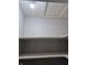 A view inside an empty closet with wire shelving and a pull light at 1584 Shady Ln, Columbus, IN 47201