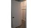 A view into a closet with a carpeted floor and wire shelving at 1584 Shady Ln, Columbus, IN 47201