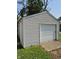 A detached single car garage with aluminum siding and concrete pad at 1584 Shady Ln, Columbus, IN 47201
