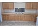 A kitchen with wooden cabinetry and stainless steel sink at 1584 Shady Ln, Columbus, IN 47201