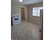 Eat-in kitchen with a white refrigerator, stove and neutral flooring at 1584 Shady Ln, Columbus, IN 47201