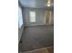 Inviting living room filled with natural light and fresh carpeting at 1584 Shady Ln, Columbus, IN 47201