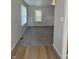 Bright living room featuring neutral walls, modern carpeting, and natural light from two window views at 1584 Shady Ln, Columbus, IN 47201