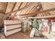 Finished attic with natural wood beams, storage boxes, and holiday decor at 1621 Beeler Ave, Speedway, IN 46224