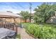 Landscaped backyard with a hot tub, small patio, and storage shed creating an enjoyable outdoor space at 1621 Beeler Ave, Speedway, IN 46224