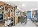 Finished basement space featuring desk, dining table and blue paneled doors at 1621 Beeler Ave, Speedway, IN 46224