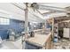 Cozy basement featuring a kitchen sink area, blue walls, and a relaxing lounge space at 1621 Beeler Ave, Speedway, IN 46224