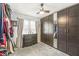 Bedroom featuring a modern dark wood dresser and large closet at 1621 Beeler Ave, Speedway, IN 46224