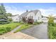 Charming two-story home with a well-manicured lawn and a detached two-car garage at 1621 Beeler Ave, Speedway, IN 46224