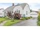 Charming two-story home featuring a landscaped front yard and a detached garage at 1621 Beeler Ave, Speedway, IN 46224