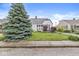 Charming home with lush lawn, mature blue spruce, garden, and inviting curb appeal at 1621 Beeler Ave, Speedway, IN 46224