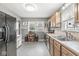Charming kitchen with stainless steel appliances, gray walls, unique tile flooring, and natural light at 1621 Beeler Ave, Speedway, IN 46224