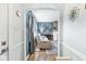 Cozy living room with hardwood floors and an arched doorway into a comfortable seating area at 1621 Beeler Ave, Speedway, IN 46224