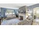 Cozy living room with hardwood floors, a fireplace, and comfortable seating at 1621 Beeler Ave, Speedway, IN 46224