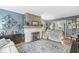 Comfortable living room featuring a decorative fireplace and an open layout to dining area at 1621 Beeler Ave, Speedway, IN 46224