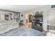 Bright living room featuring hardwood floors, an area rug, and an open concept layout at 1621 Beeler Ave, Speedway, IN 46224