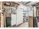 Basement space with refrigerator and shelving, ideal for storage at 1621 Beeler Ave, Speedway, IN 46224