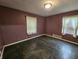 The bedroom has a large window and new carpet at 1628 Edgewood Dr, Anderson, IN 46011