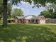 Charming red brick home with a well-manicured front lawn and a convenient attached garage at 1628 Edgewood Dr, Anderson, IN 46011