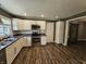 Updated kitchen featuring modern appliances, granite countertops, and ample cabinet space at 1628 Edgewood Dr, Anderson, IN 46011
