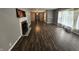 Spacious living room with fireplace and hardwood floors is awaiting its new owners personal touches at 1628 Edgewood Dr, Anderson, IN 46011