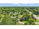 Bird's eye view of a charming neighborhood featuring neatly arranged homes surrounded by vibrant green trees at 17 E Beechwood Ln, Indianapolis, IN 46227