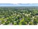 Aerial shot of a quiet residential area, highlighting the spacious lots and abundance of mature trees at 17 E Beechwood Ln, Indianapolis, IN 46227