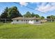 Expansive backyard with lush lawn, privacy fence, and mature trees offering shade and seclusion at 17 E Beechwood Ln, Indianapolis, IN 46227