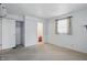 A bedroom with built-in shelving, a window and view to the bathroom at 17 E Beechwood Ln, Indianapolis, IN 46227