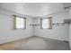 An empty room with neutral paint, neutral carpeting, and two windows at 17 E Beechwood Ln, Indianapolis, IN 46227