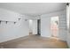 A bright room with neutral carpeting and a view to the bathroom at 17 E Beechwood Ln, Indianapolis, IN 46227