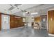 Spacious garage featuring paneled walls, overhead lighting, and ample room for storage or projects at 17 E Beechwood Ln, Indianapolis, IN 46227