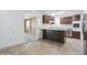 Kitchen featuring an island and stainless steel appliances with a view to living room at 17 E Beechwood Ln, Indianapolis, IN 46227
