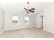 Neutral bedroom features plush carpet, a ceiling fan, and natural light from the double windows at 174 Straughn Ln, Westfield, IN 46074
