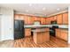 Eat-in kitchen features an island, black appliances, and lots of cabinet space at 174 Straughn Ln, Westfield, IN 46074