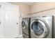 Well-equipped laundry room with modern, side-by-side washer and dryer for convenience at 174 Straughn Ln, Westfield, IN 46074