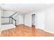 This spacious living room features stairs, hardwood floors and a convenient powder room at 174 Straughn Ln, Westfield, IN 46074