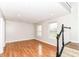 Bright living room features recessed lighting, hardwood floors and stairs to the next level at 174 Straughn Ln, Westfield, IN 46074