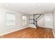 The living room features recessed lighting, hardwood floors and access to the staircase at 174 Straughn Ln, Westfield, IN 46074
