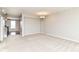 Bright, spacious living room with neutral carpet, chandelier, and an open entryway at 174 Straughn Ln, Westfield, IN 46074