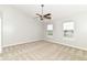 Spacious main bedroom features a ceiling fan, neutral carpeting and paint, and large windows at 174 Straughn Ln, Westfield, IN 46074