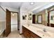 Bright bathroom features a double vanity with ample counter space and a large mirror at 1783 Cloister Dr, Indianapolis, IN 46260