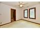 Spacious bedroom with neutral walls, a ceiling fan, and natural light from multiple windows at 1783 Cloister Dr, Indianapolis, IN 46260