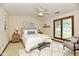 Inviting bedroom with ceiling fan, neutral colors, and ample natural light at 1783 Cloister Dr, Indianapolis, IN 46260