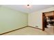 Cozy bedroom with soft carpeting and access to the kitchen space at 1783 Cloister Dr, Indianapolis, IN 46260