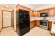 Well-equipped kitchen featuring wooden cabinets and stainless steel appliances at 1783 Cloister Dr, Indianapolis, IN 46260