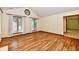 Bright living room with hardwood floors, multiple windows, and modern fixtures at 1783 Cloister Dr, Indianapolis, IN 46260